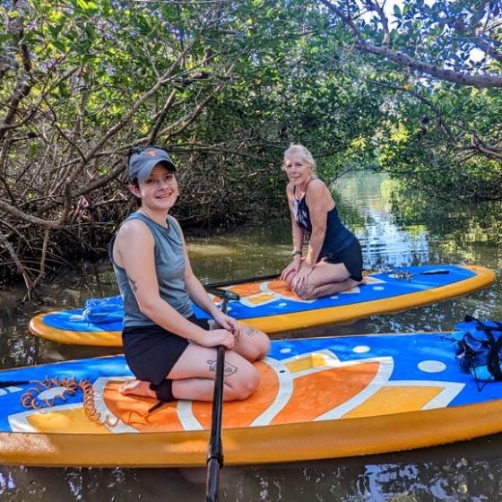 a person riding on the back of a boat
