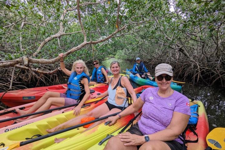 a group of people sitting on a raft