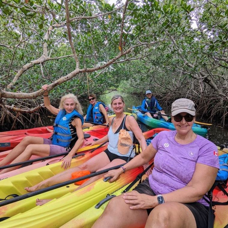 a group of people sitting on a raft