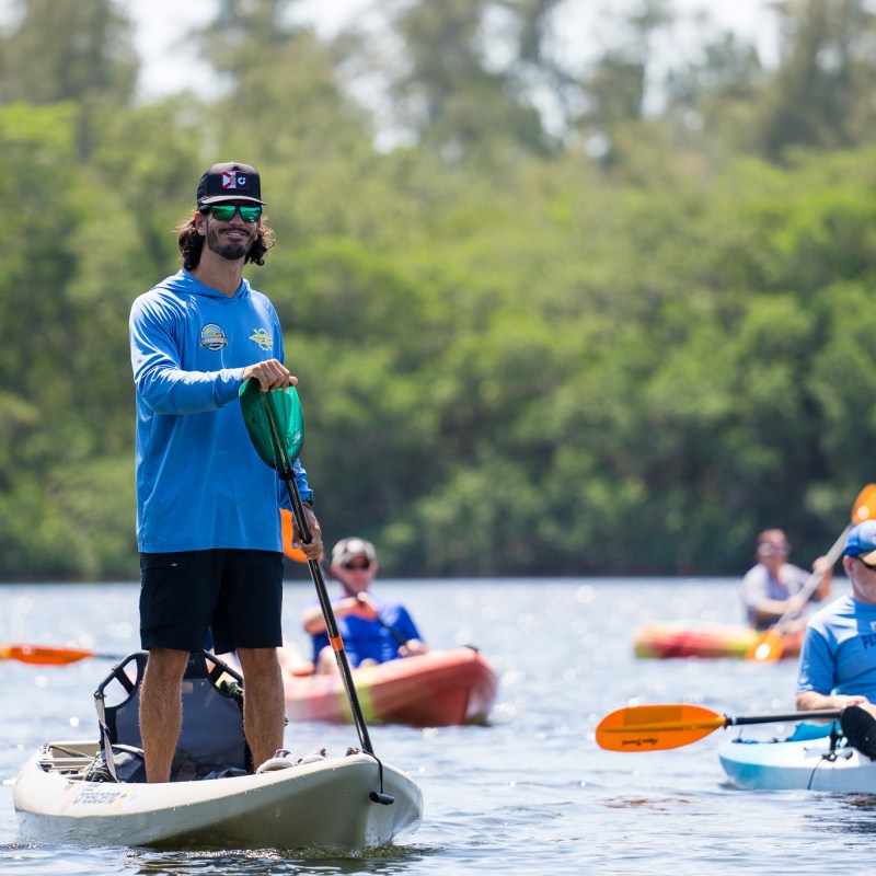 a group of people riding on the back of a boat