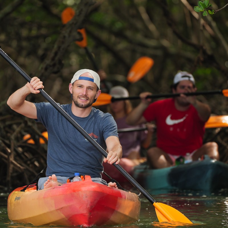 a person rowing a boat in the water