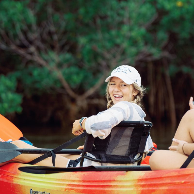 a group of people riding on the back of a boat